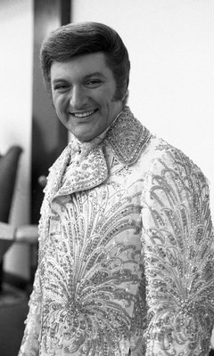 Liberace poster with hanger